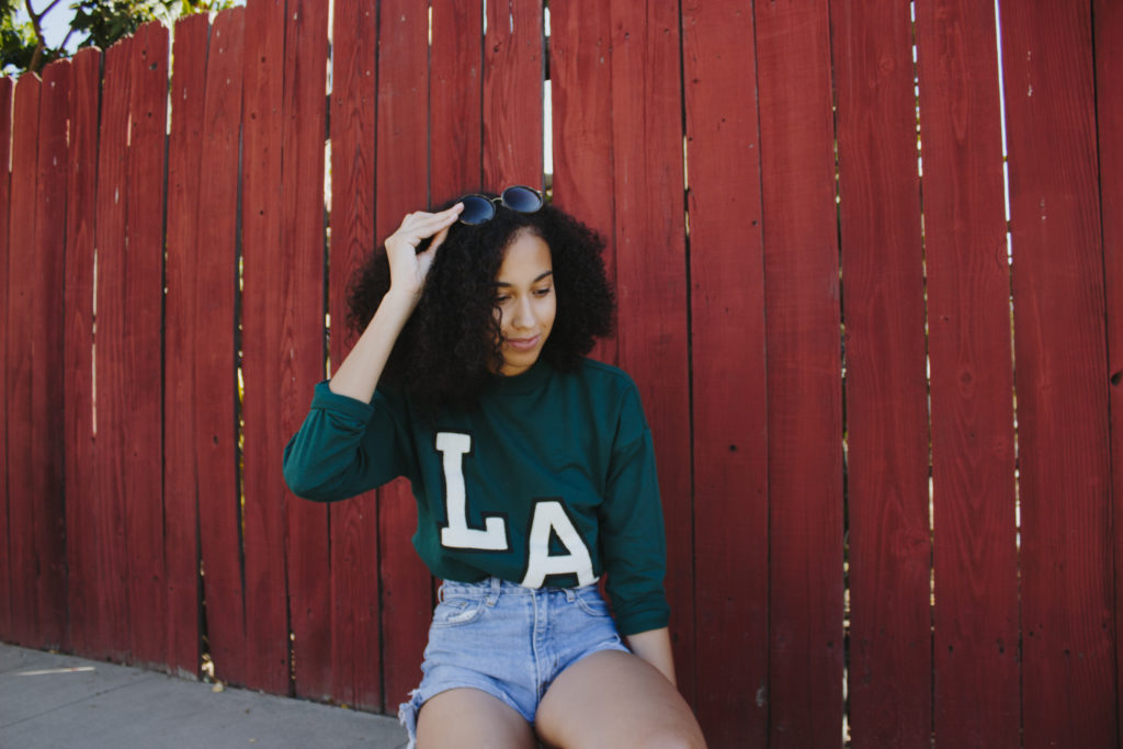 Eco-friendly Adopted Since Moving to LA - Outfit featuring LA sweater and high waisted shorts